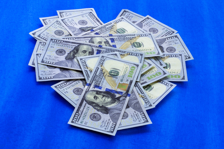 Heart of money love 100 dollars on blue backgroundの写真素材