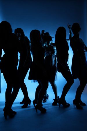 Silhoutte of dancing girlsの写真素材
