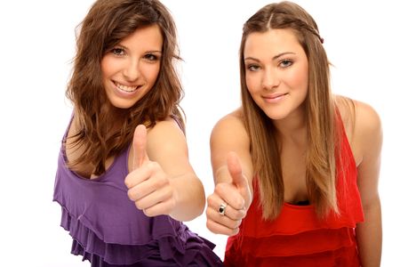 Two teenagers positively gesturingの写真素材