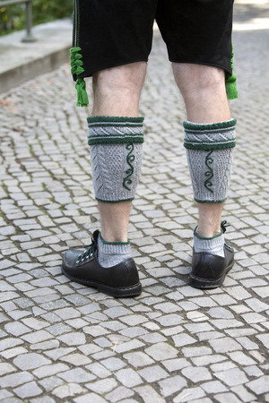 closeup of legs of a bavarian man in traditional costumeの写真素材