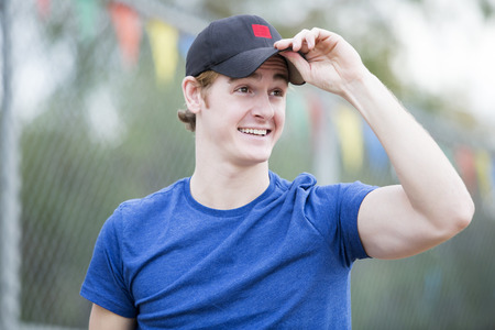 portrait of a handsome man in a hatの写真素材