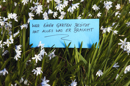 handwritten German words \Who has a garden everything he needs\ (Those Who own a garden have...