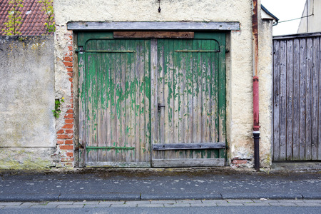 old green wooden barn doorの写真素材