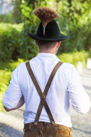 backside of a man in traditional bavarian clothesの写真素材