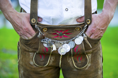 closeup of man wearing traditional bavarian leather pantsの写真素材