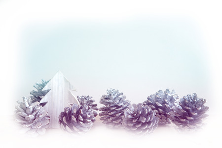white pinecones and miniature toy treeの写真素材