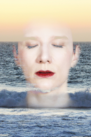 Double exposure portrait of a woman combined with sunset and ocean