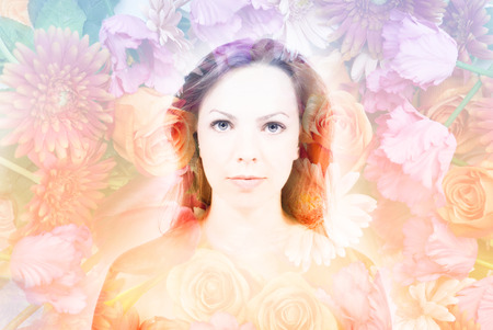 double exposure of beautiful woman with flowers looking at camera