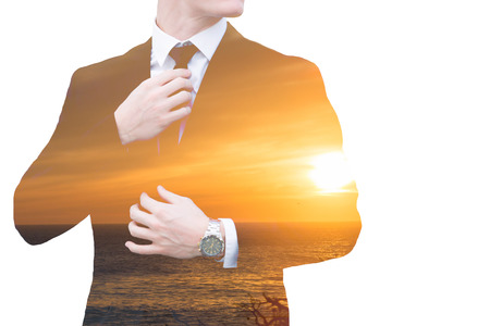 double exposure of businessman and ocean with sunset