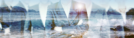 double exposure of businesspeople and beach with waves