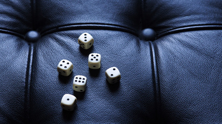 six dice on black leatherの写真素材