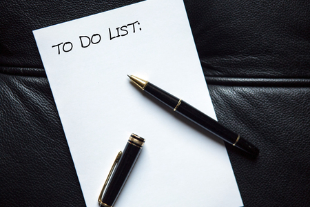 pen and the words To Do List written on white paper の写真素材