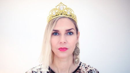 portrait of beautiful blond woman with crownの写真素材