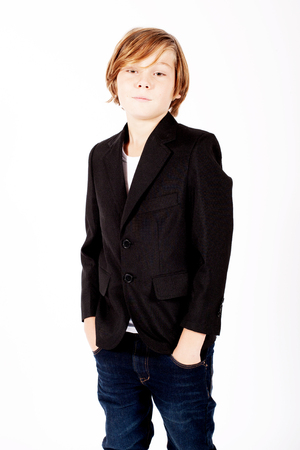 portrait of handsome young blond boy wearing a black jacketの写真素材