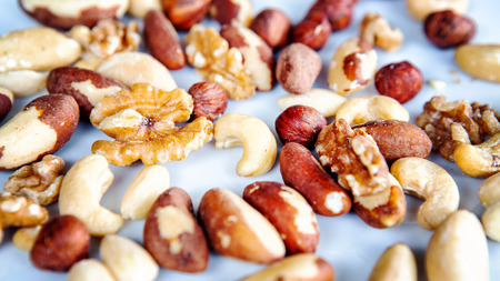 group of mixed nuts on a white plate