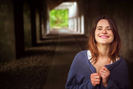 portrait of beautiful brunette woman smiling at camera