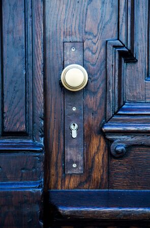 close-up of old wooden door with door knobの写真素材
