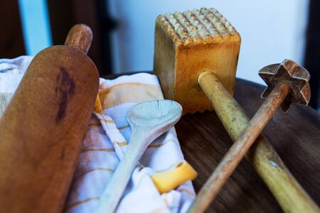close-up of wooden kitchen utensils and kitchen towel