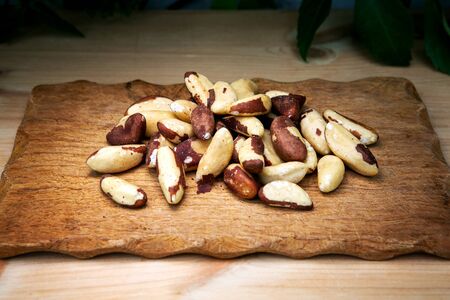 close-up of brazil nuts on wooden boardの写真素材