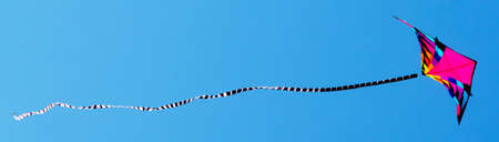 banner of colorful kite in the blue skyの写真素材