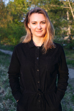 portrait of young brunette woman in parkの写真素材