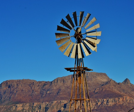 Landscape with water pump windmill on farm westerncape south africa