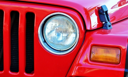 Details of a bright red 4x4