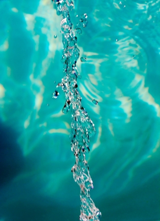Close up of running water in green
