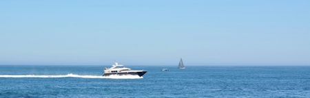 Seascape with Motor Yacht speeding over the Atlantic Ocean