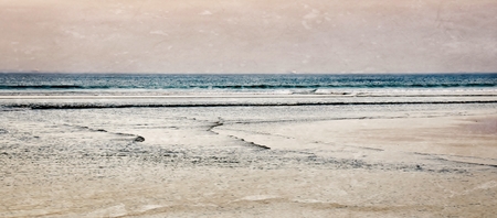 Seascape with the beach in morning lightの写真素材