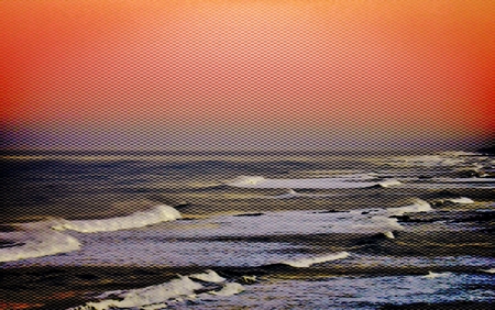 Landscape with the rocky coastline of Strandfontein at sunset