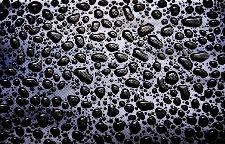 Close up of rain drops on a black backgroundの写真素材