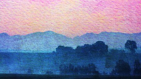 Landscape with morning fog over trees at sunriseの写真素材