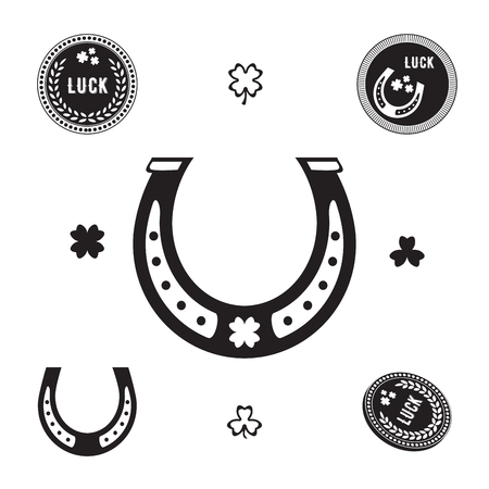 Set of luck silhouette symbols - horseshoe, shamrock, coins with cloverのイラスト素材