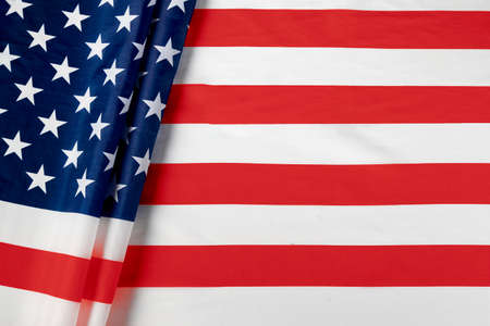 Close up of ruffled American flag. Satin texture curved flag of USA. Memorial Day or 4th of July....