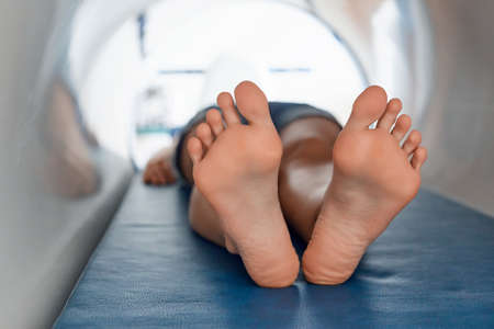 The magnetic field, rehabilitation. A woman uses a magnetic therapy system to treat and prevent diseases.の写真素材