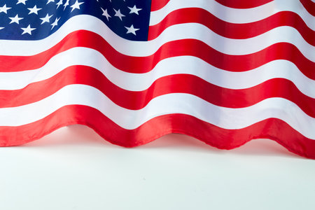 Close up of ruffled American flag. Satin texture curved flag of USA. Memorial Day or 4th of July....