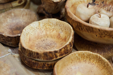 Wood texture. Showing growth rings.Rustic design. Set of hand made wooden dishes. Close up.