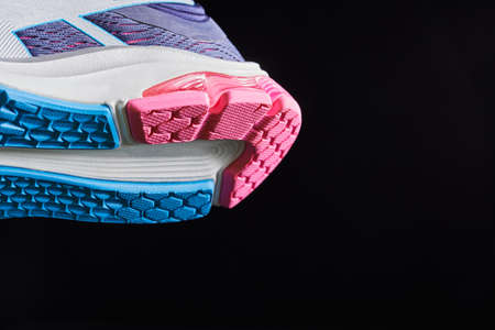 Fragment of a sole on sneaker. The texture of the material of sports shoes. Style footwear for running.の写真素材