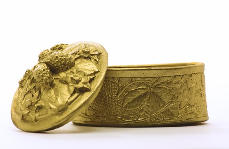 Wooden box painted in gold color isolated on whiteの写真素材