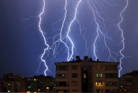 Multiple lightning over bright blue sky in the night