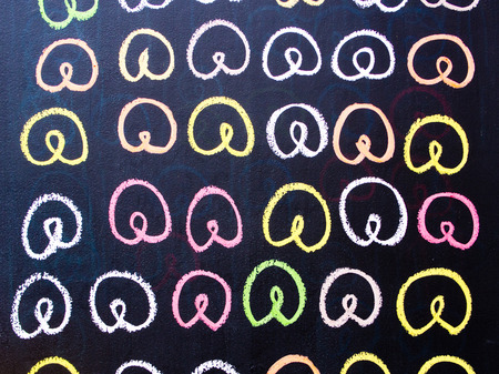 Colorfull pretzel drawing on a chalk boardの写真素材