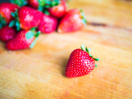 Fresh strawberry on a wooden boardの写真素材