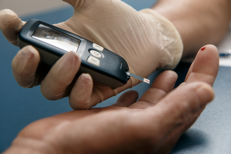 medical or nursing care to measure glycogen levels with medical device.の写真素材