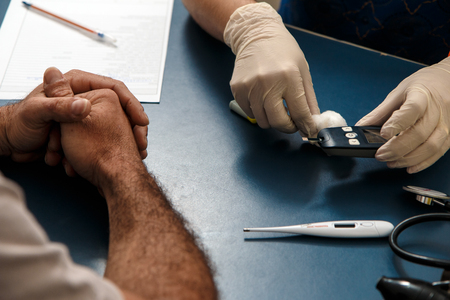 Medical or nursing care to measure glycogen levels with medical device.の写真素材