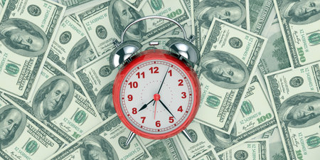 Conceptual Idea of Time is Money - Dollar Bills Scattered with a Clock in the Foregroundの写真素材