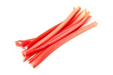 Rhubarb sticks or stalks uncooked isolated on a white studio background.の写真素材