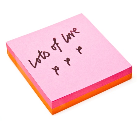 Post-it note isolated on a white studio background.
