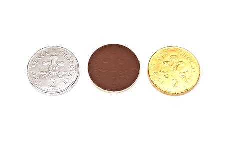 Chocolate coins or money isolated on a white studio background.の写真素材