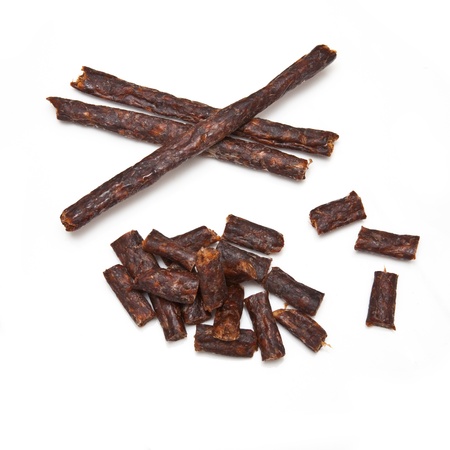 South African spicy Peri peri drywors (dried sausage jerky) isolated on a white studio background.の写真素材